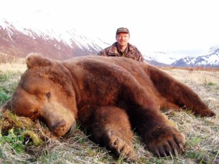 Hunter with a trophy Alaska Peninsula Brown Bear