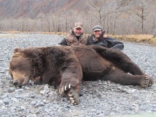 Happy hunters with a Kodiak Brown Bear