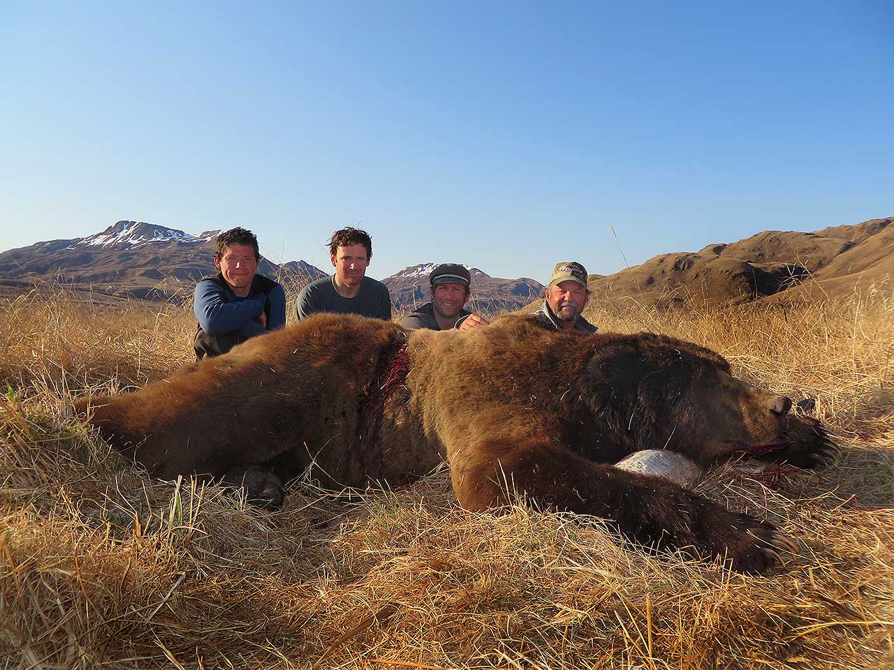 Hunters with a harvested Kodiak Brown Bear