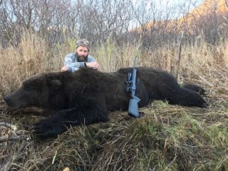 Hunter with a large Kodiak Brown Bear