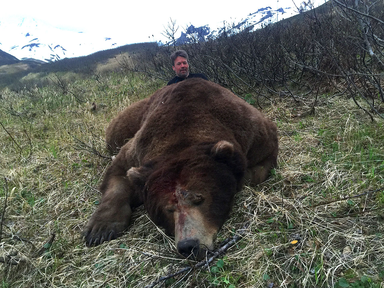 Hunter with Alaska Peninsula Brown Bear